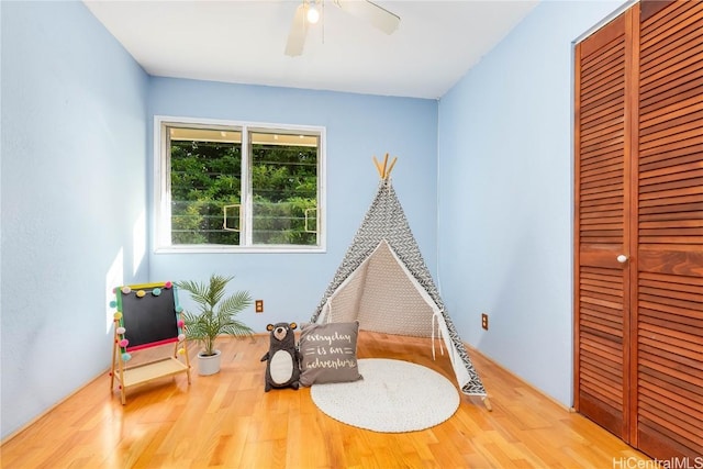 game room with ceiling fan and hardwood / wood-style floors