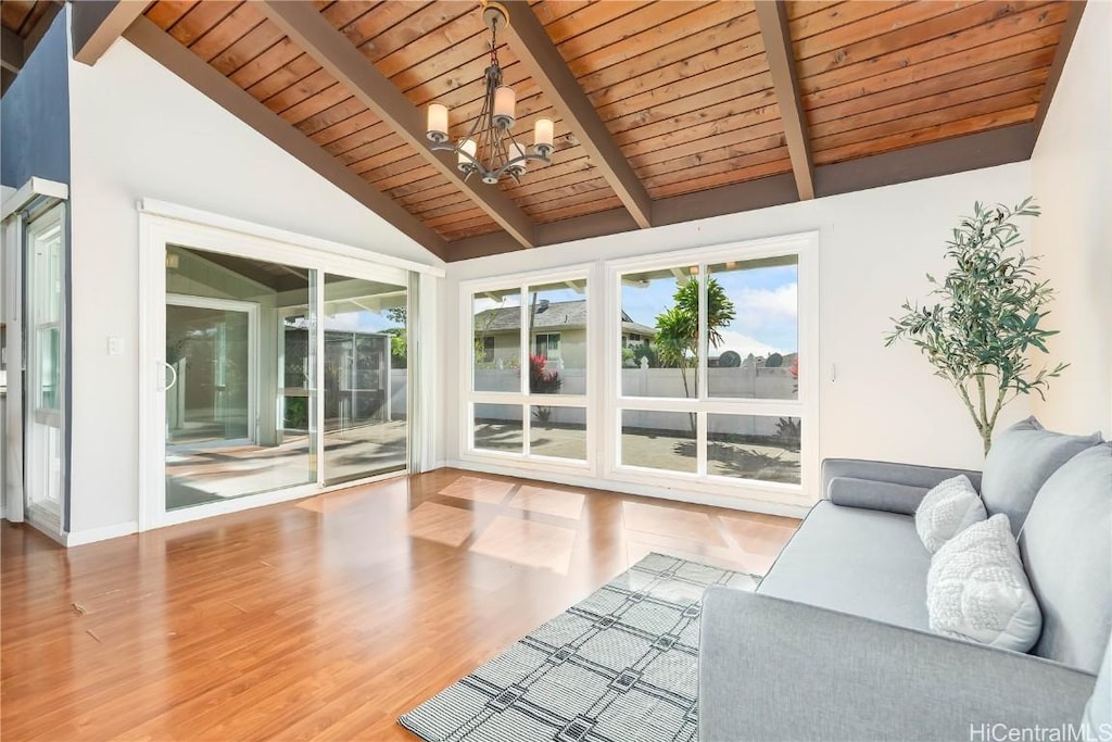 unfurnished sunroom with vaulted ceiling with beams, wood ceiling, and an inviting chandelier