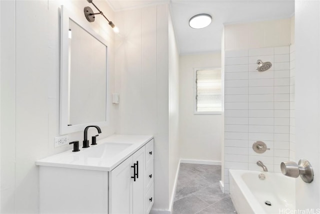 full bathroom featuring vanity, bathing tub / shower combination, and baseboards