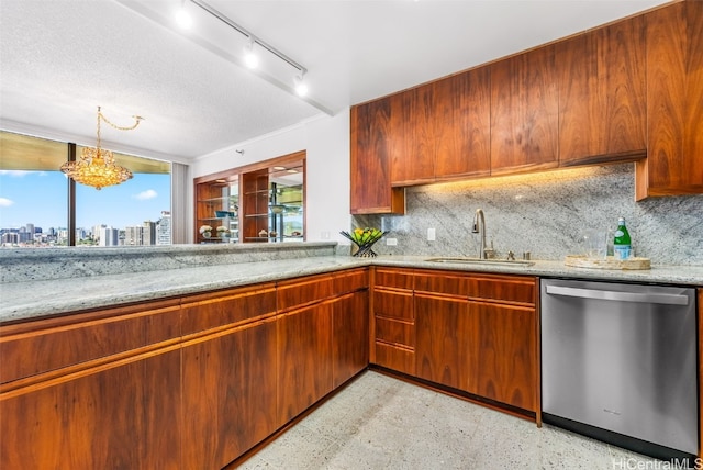 kitchen with dishwasher, light stone countertops, sink, and tasteful backsplash