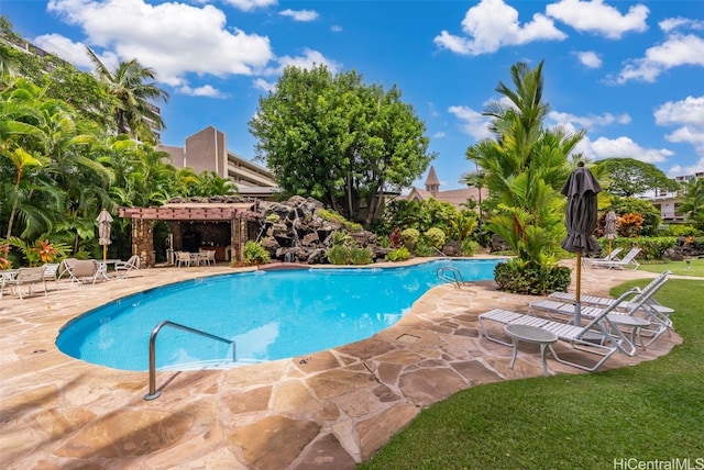 view of swimming pool featuring a pergola and a patio