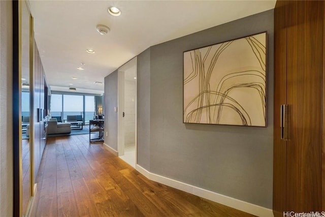 corridor featuring hardwood / wood-style floors