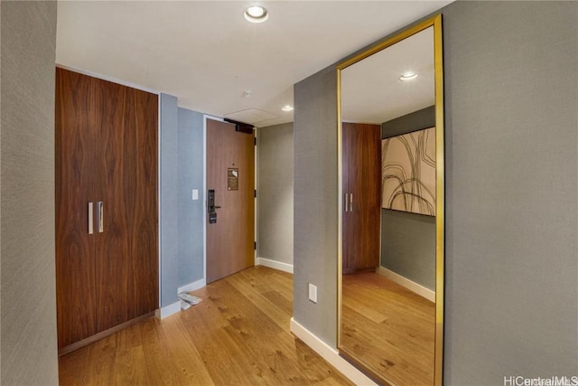 hall with light hardwood / wood-style floors