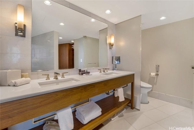 bathroom featuring tile patterned flooring, vanity, and toilet