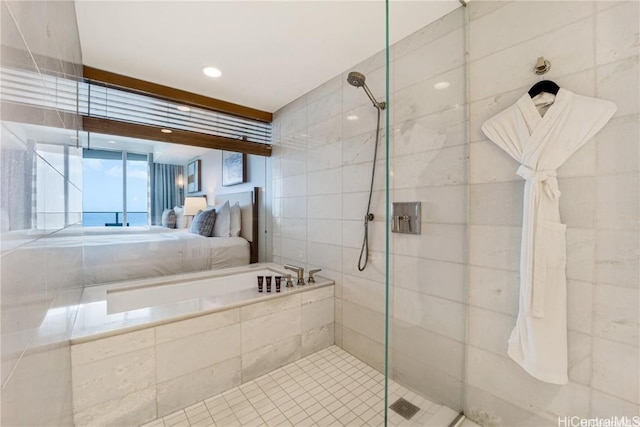 bathroom featuring shower with separate bathtub and tile patterned floors