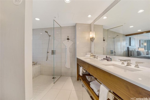 bathroom with tile patterned floors, vanity, and a shower with shower door