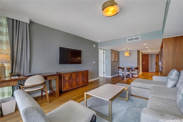 living room with light hardwood / wood-style floors