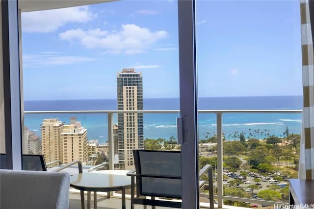 balcony featuring a water view