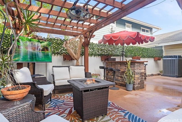 view of patio with a pergola, central AC, a bar, and an outdoor living space with a fire pit