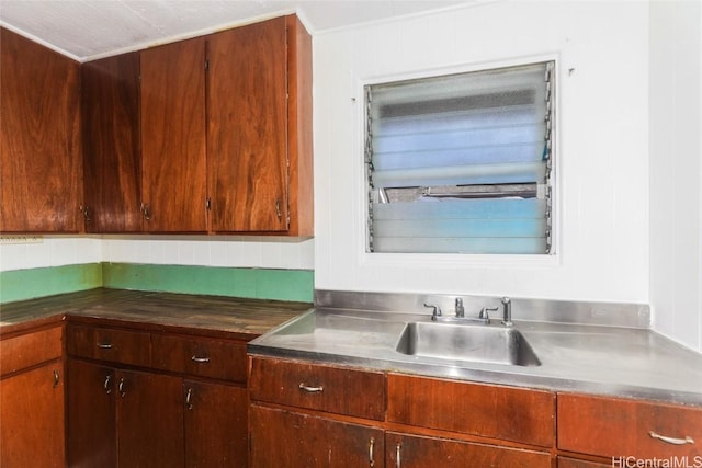 kitchen featuring decorative backsplash and sink