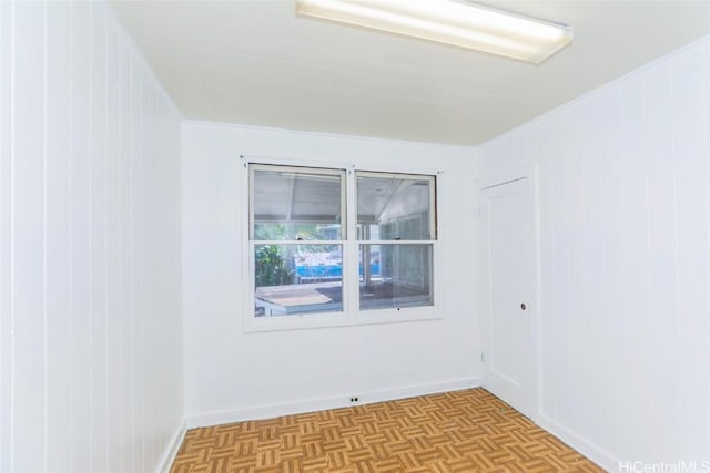 spare room with light parquet flooring