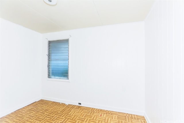 unfurnished room with light parquet flooring