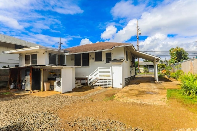 rear view of house featuring washer / dryer