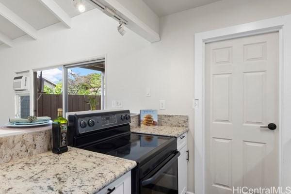 kitchen with beam ceiling, light stone countertops, black electric range, track lighting, and white cabinets