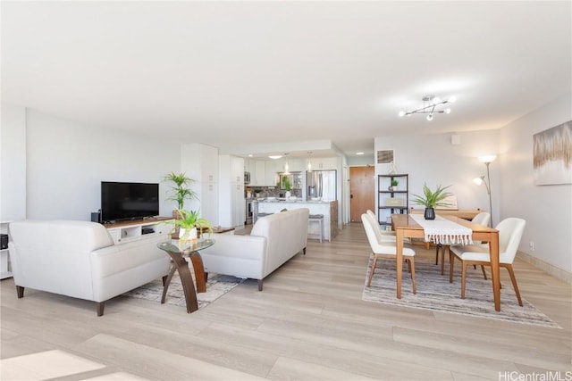 living room with light hardwood / wood-style flooring