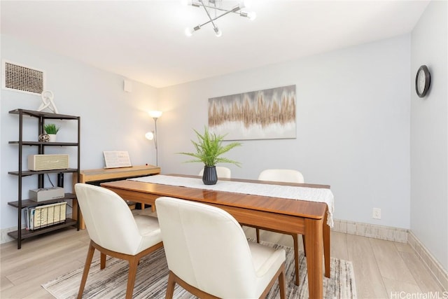 dining area featuring light wood-type flooring