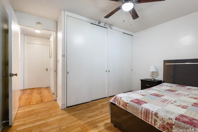 bedroom featuring ceiling fan and light hardwood / wood-style floors