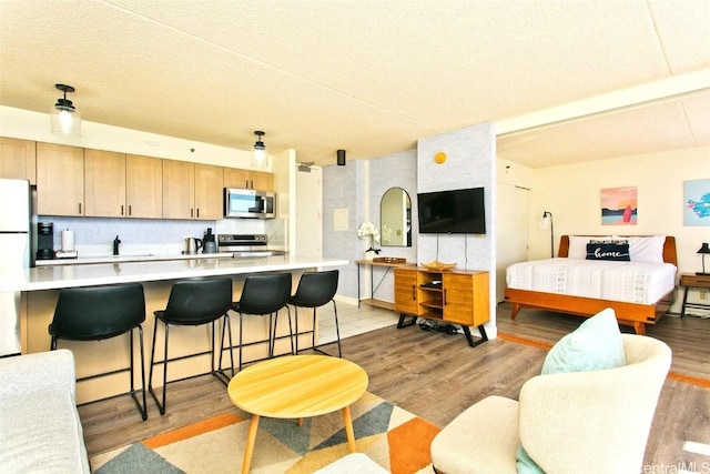 interior space with white refrigerator and light wood-type flooring