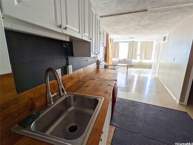 435 Seaside Ave Unit 209, Honolulu, HI 96815 - kitchen featuring light tile patterned floors and white electric stove