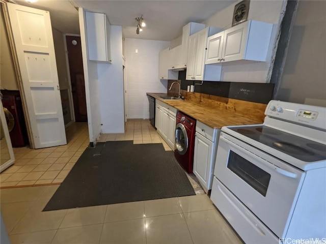 kitchen with white range with electric cooktop, washer / clothes dryer, white cabinets, and light tile patterned floors