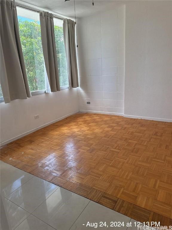 spare room with light parquet floors