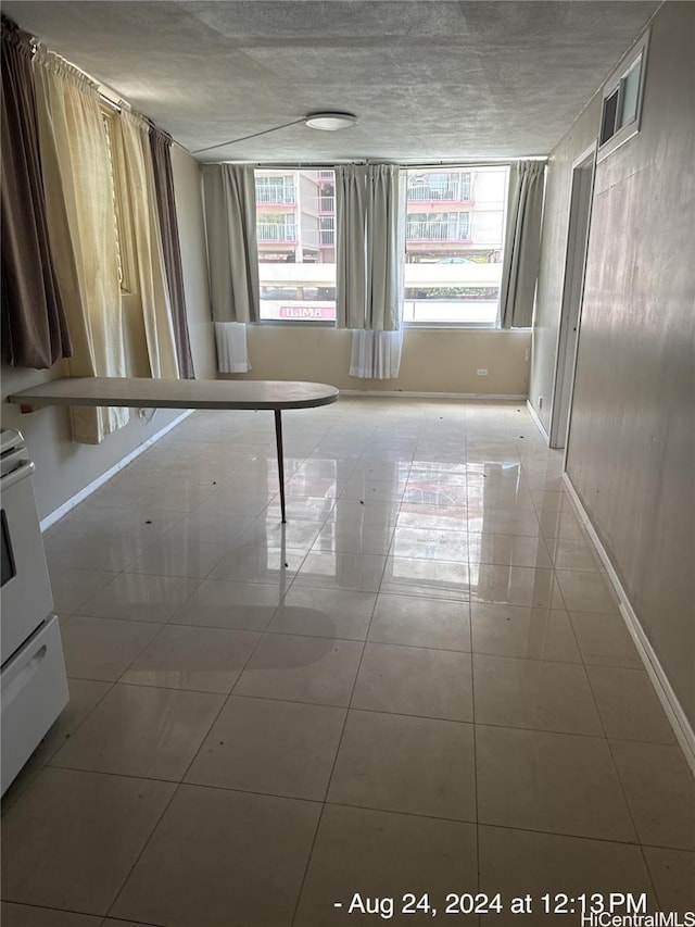 435 Seaside Ave Unit 209, Honolulu, HI 96815 - unfurnished room with baseboards and tile patterned floors