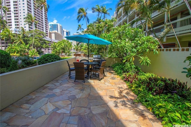 435 Seaside Ave Unit 209, Honolulu, HI 96815 - view of patio featuring outdoor dining area and a view of city