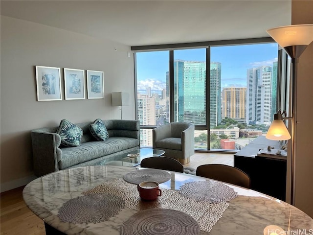 living room with floor to ceiling windows and hardwood / wood-style floors