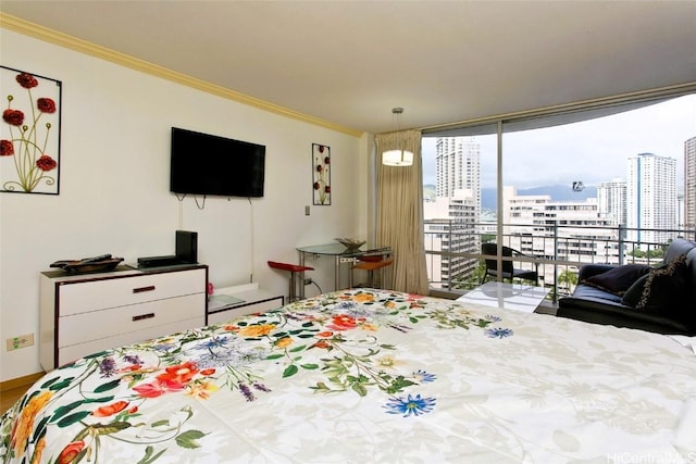 bedroom with access to exterior and ornamental molding