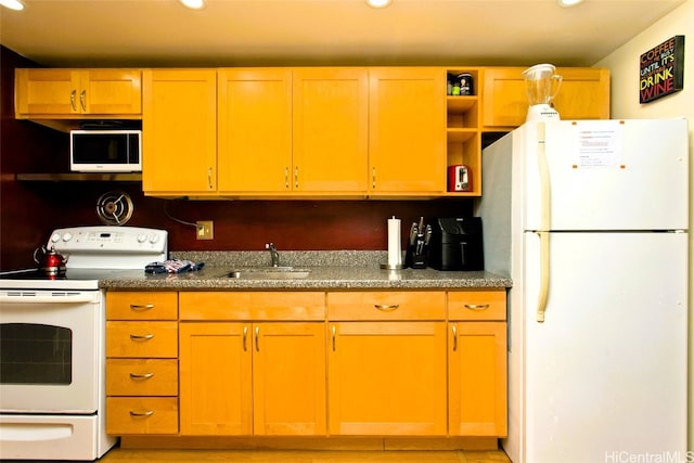 kitchen featuring white appliances and sink