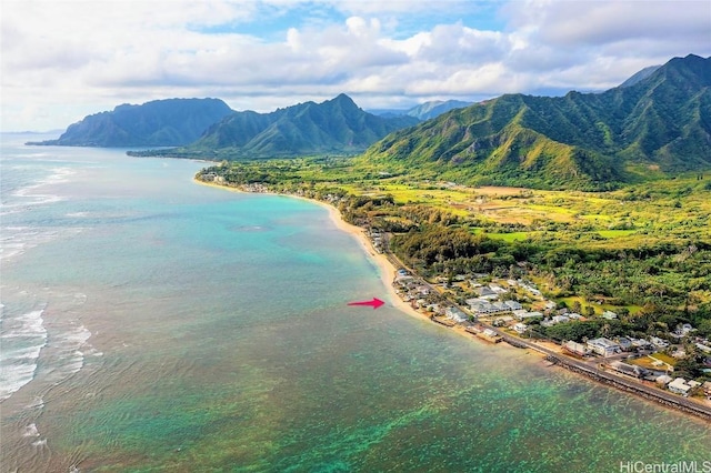 drone / aerial view featuring a water and mountain view