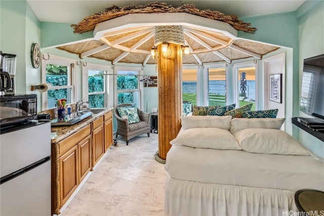 interior space featuring vaulted ceiling and sink