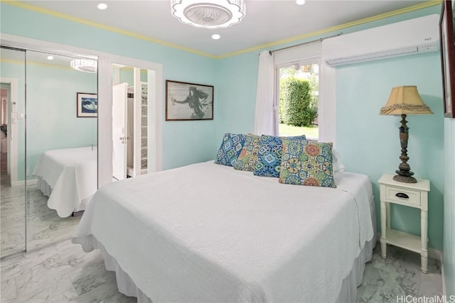 bedroom featuring crown molding, a closet, and a wall mounted AC