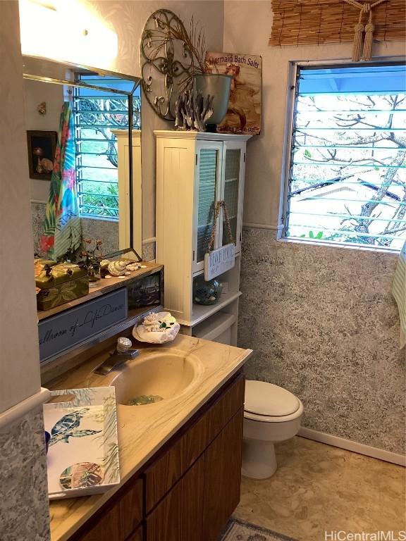 bathroom featuring vanity and toilet