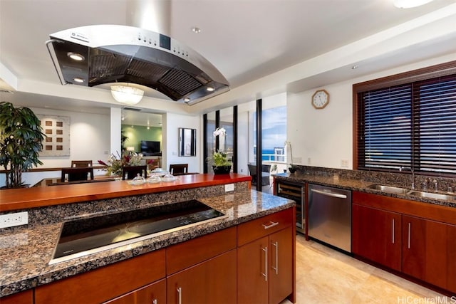 kitchen with black electric stovetop, sink, stainless steel dishwasher, dark stone countertops, and island range hood