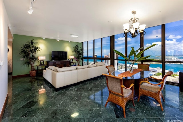 600 Queen St Unit 4302, Honolulu, HI 96813 - dining space with baseboards, a chandelier, floor to ceiling windows, and track lighting
