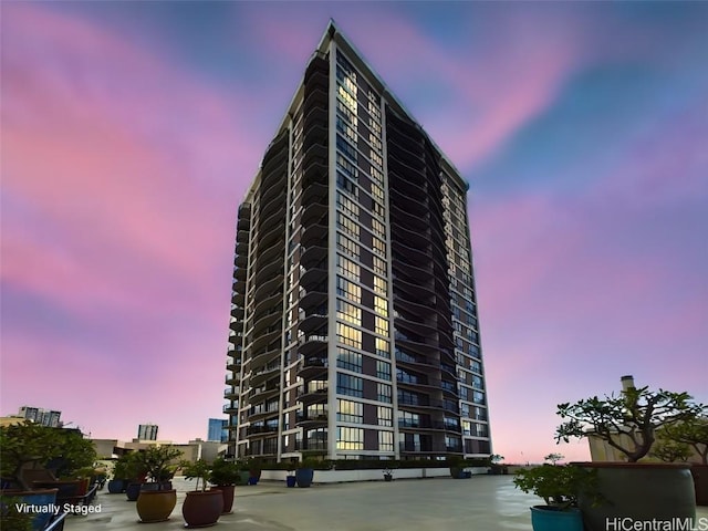 view of outdoor building at dusk