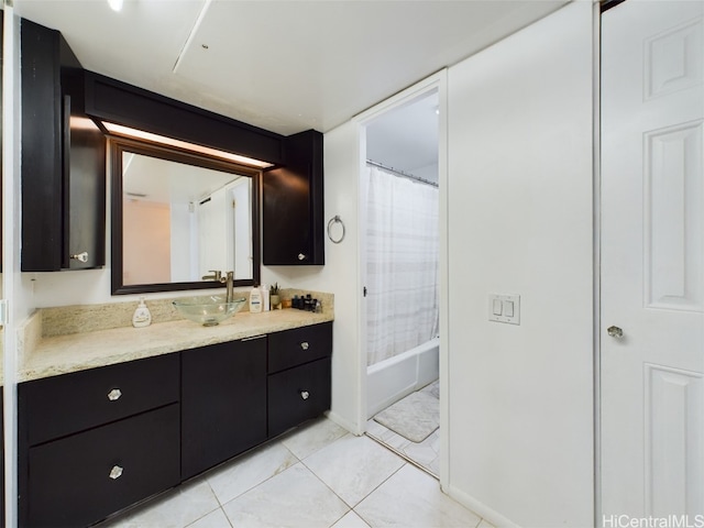 bathroom featuring tile patterned flooring, vanity, and shower / tub combo with curtain