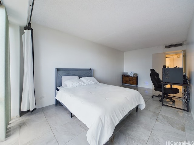 bedroom featuring a textured ceiling