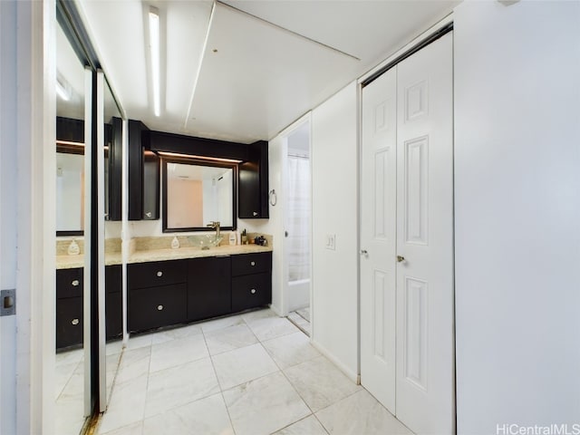 bathroom featuring shower / bath combination with curtain and vanity