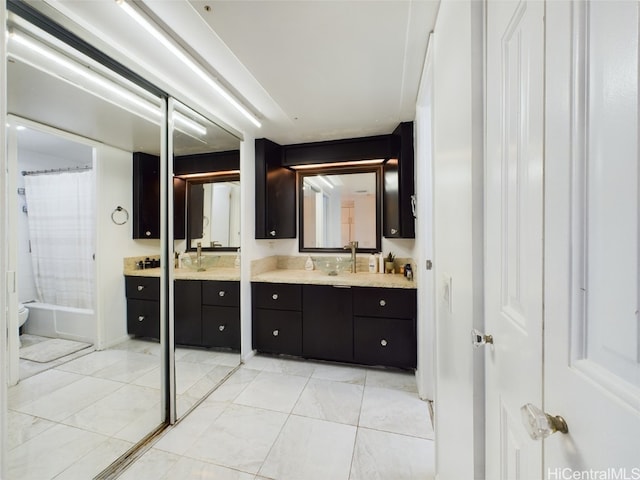 bathroom featuring shower / bathtub combination with curtain and vanity