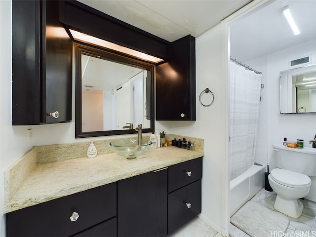 full bathroom featuring vanity, shower / tub combo, and toilet