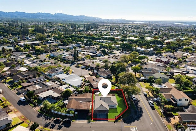 birds eye view of property with a mountain view