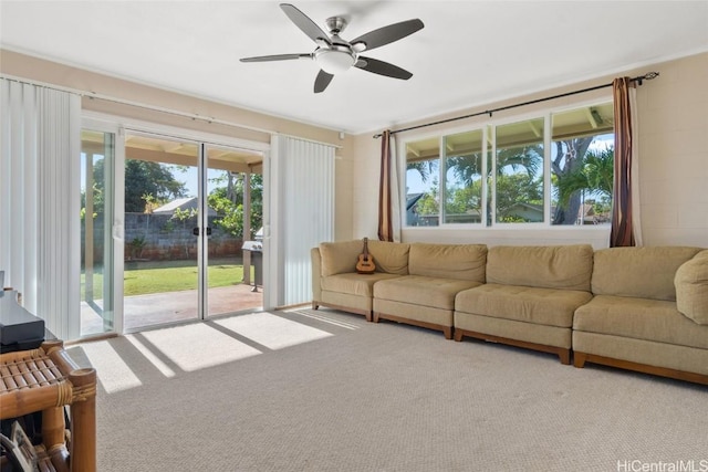 living room with ceiling fan and carpet floors