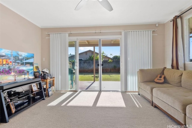 living room with ceiling fan and carpet floors