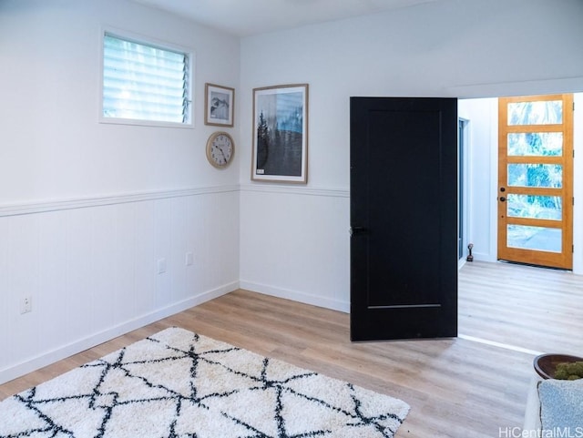 empty room with light hardwood / wood-style floors