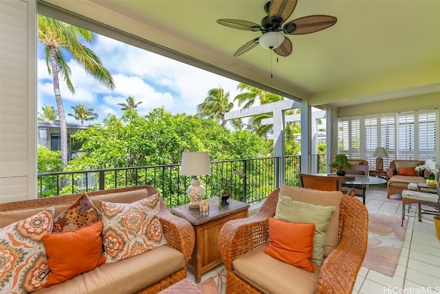 sunroom / solarium featuring ceiling fan