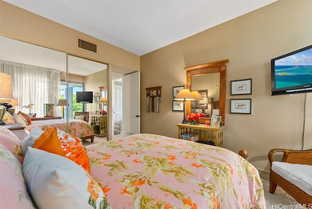 carpeted bedroom with a closet and lofted ceiling