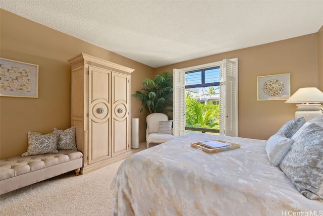 carpeted bedroom featuring a textured ceiling