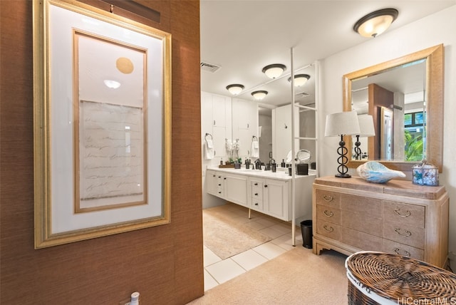 bathroom featuring tile patterned flooring and vanity